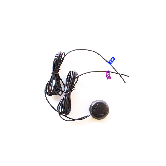 A dual GSM/GPS disc antenna with a 3 meters RG174 cable, featuring black cables and a grey disc-shaped antenna.